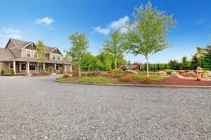 large home with gravel driveway